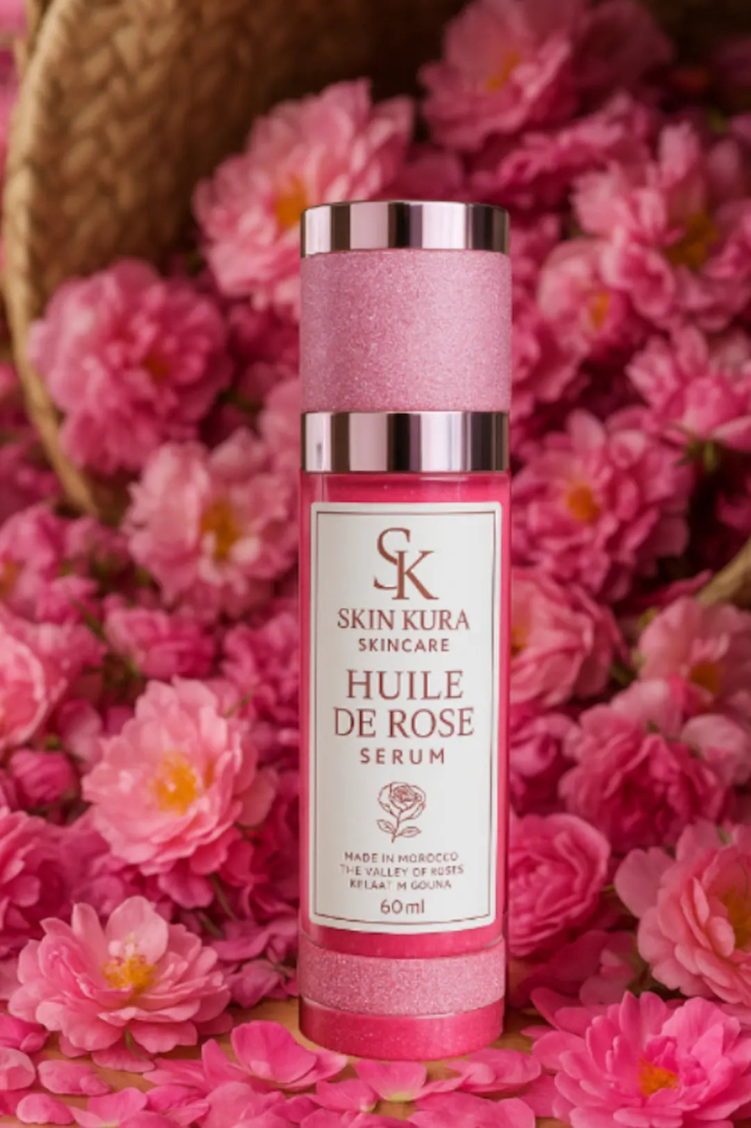 Skinkura Huile de Rose serum 60 ml bottle with pink roses—made in Kelaat M’Gouna, the Valley of Roses, Ouarzazate, Morocco; rose water & rose oil formula.