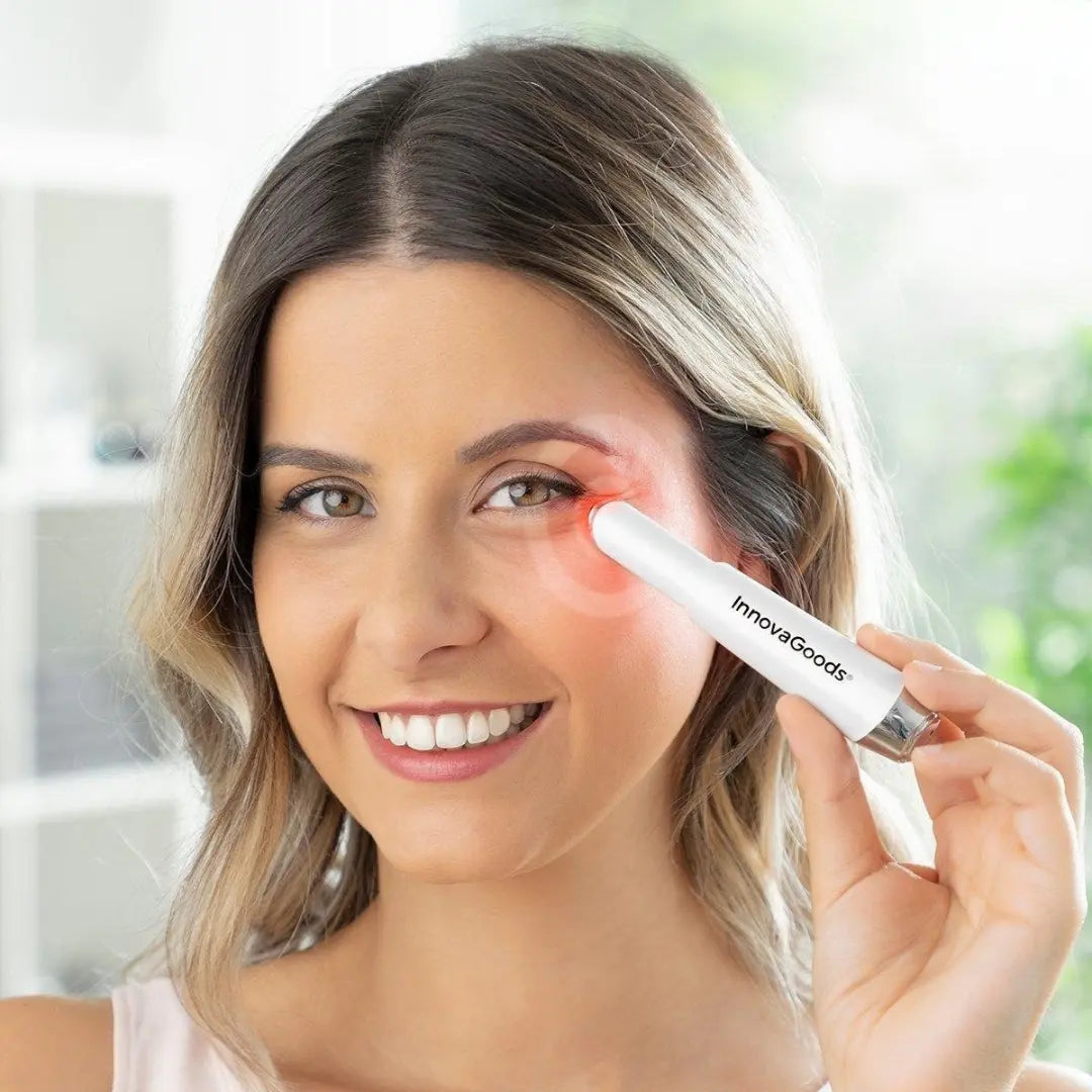 Woman using InnovaGoods Anti-Ageing Eye Massager around eye contour