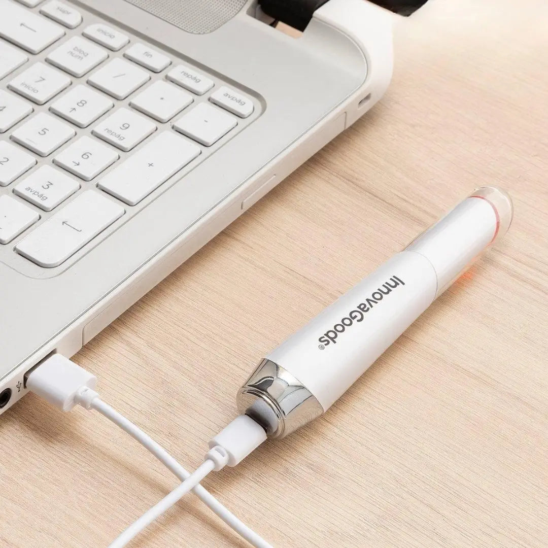 USB charging of InnovaGoods Eye Massager showing portable design