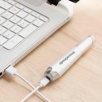 USB charging of InnovaGoods Eye Massager showing portable design
