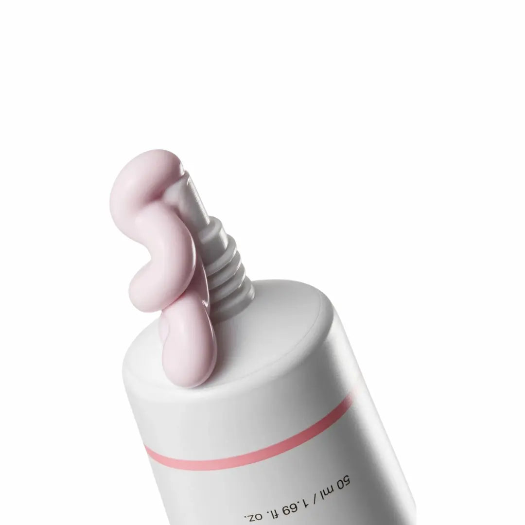 Peach-tinted sunscreen texture | tone-up, no white cast