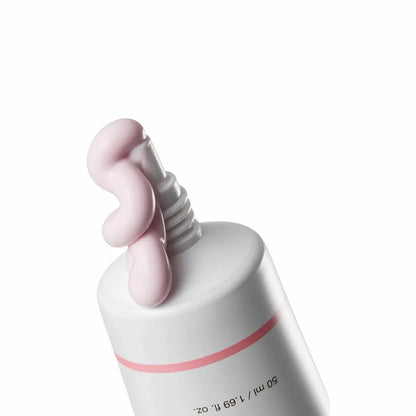 Peach-tinted sunscreen texture | tone-up, no white cast