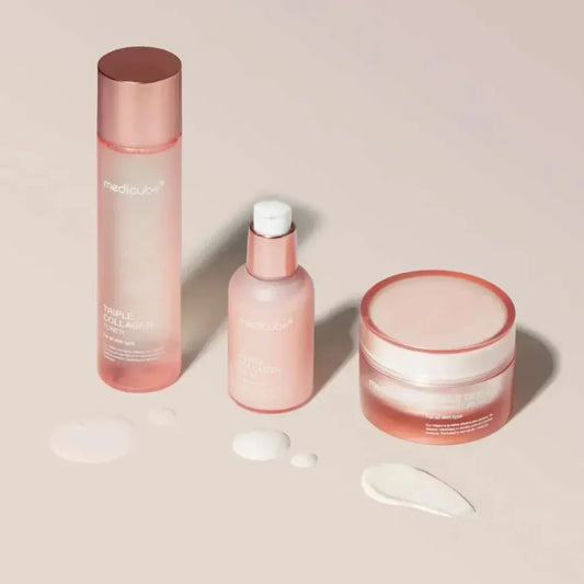 Layered routine flatlay — toner, serum, cream for hydration, elasticity and glow