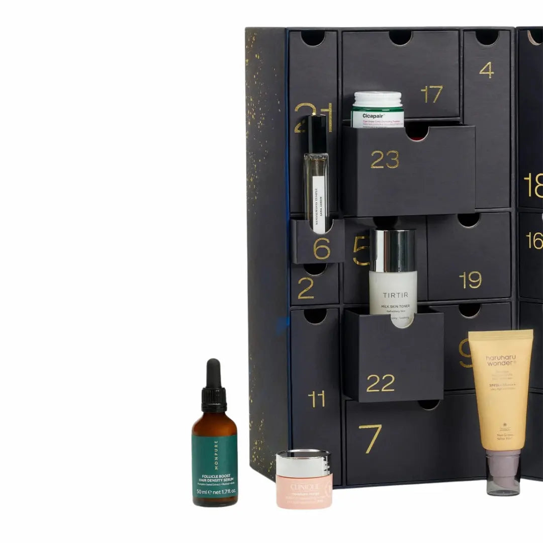 Open Skinkura Advent Calendar 2025 showing 24 luxury skincare and K-Beauty products from brands like Sol de Janeiro, Elemis, and Lancôme.